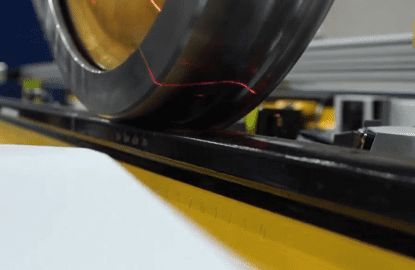 Laser beam illuminates locomotive wheel