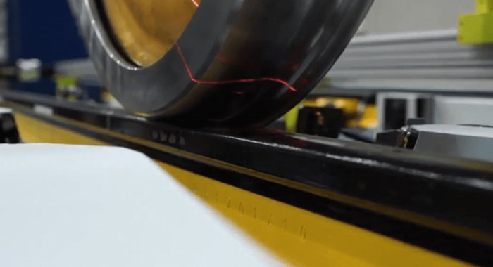 Laser beam illuminates locomotive wheel