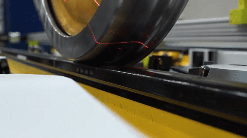 Laser beam illuminates locomotive wheel